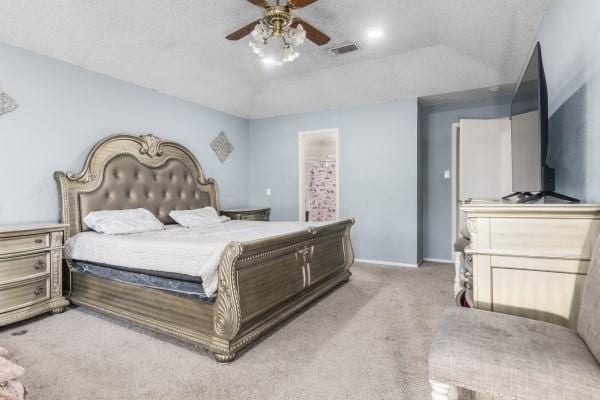 bedroom featuring carpet flooring, ceiling fan, and a textured ceiling