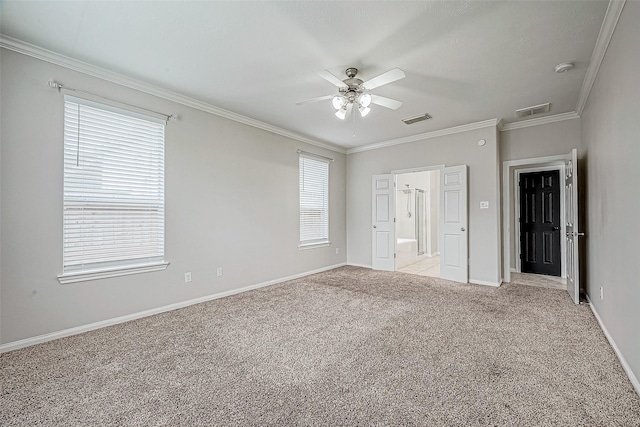 interior space featuring multiple windows, ceiling fan, and light colored carpet