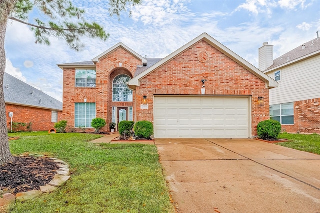 view of property featuring a garage and a front lawn