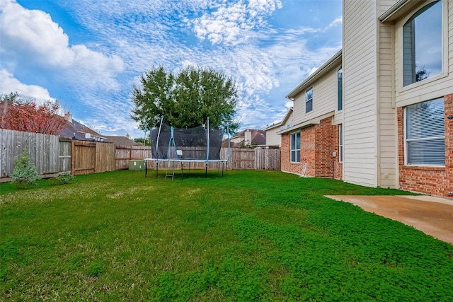 view of yard with a trampoline