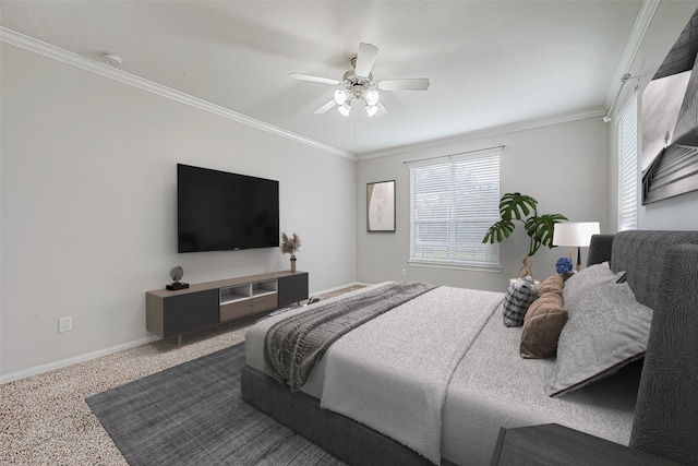 carpeted bedroom with ceiling fan and ornamental molding