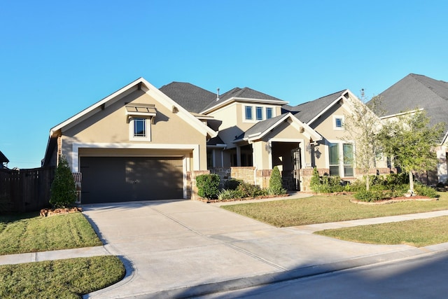 craftsman house with a front lawn and a garage