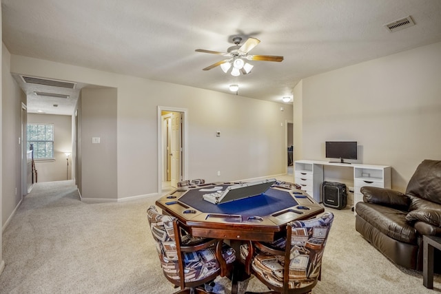 interior space with light colored carpet and ceiling fan