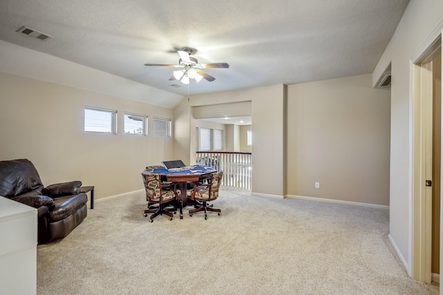 interior space with a textured ceiling, ceiling fan, a healthy amount of sunlight, and lofted ceiling