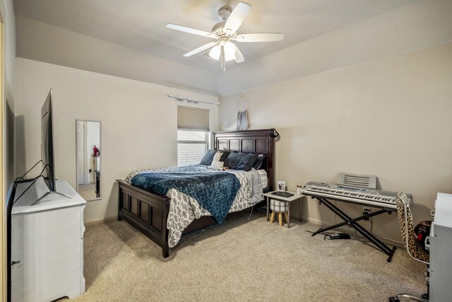 carpeted bedroom with ceiling fan and lofted ceiling