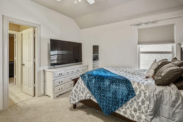 carpeted bedroom with vaulted ceiling and ceiling fan