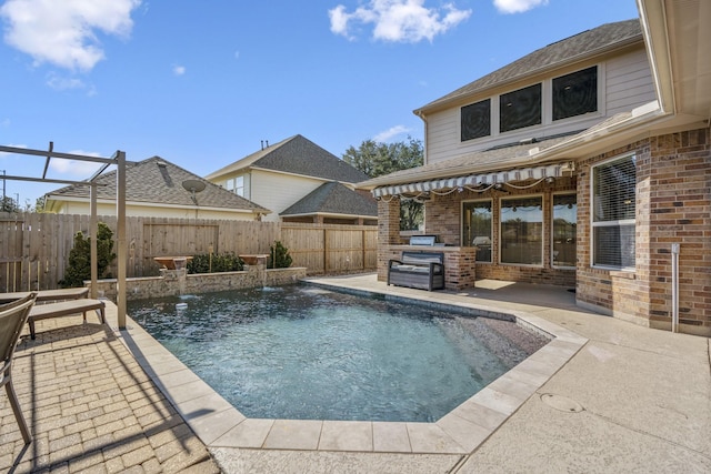 view of pool featuring pool water feature and a patio area