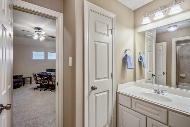 bathroom with ceiling fan, vanity, and a shower with shower curtain