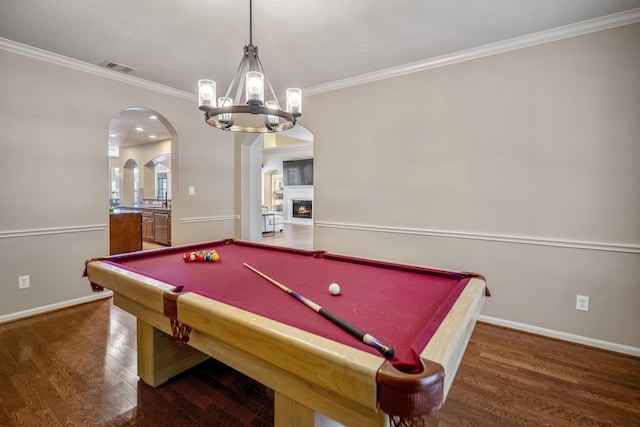 game room featuring dark hardwood / wood-style flooring, crown molding, and billiards