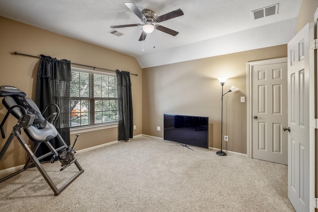 workout area with carpet, ceiling fan, and lofted ceiling