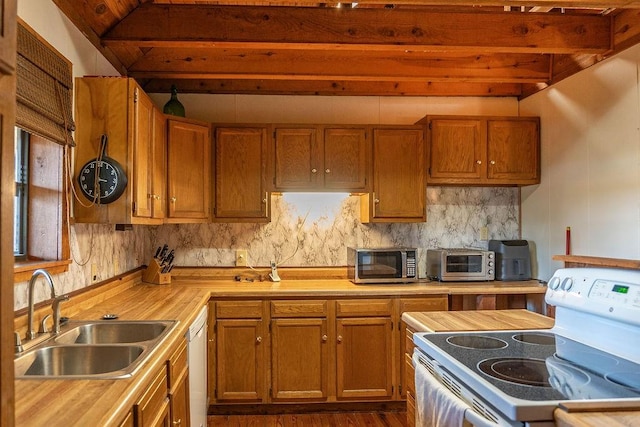 kitchen with decorative backsplash, white appliances, sink, beamed ceiling, and dark hardwood / wood-style floors