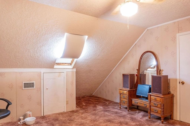 bonus room with carpet flooring, a textured ceiling, and vaulted ceiling