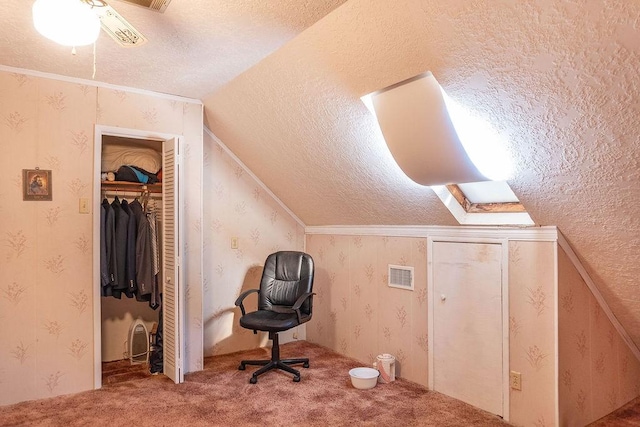 bonus room with a textured ceiling, carpet, and vaulted ceiling