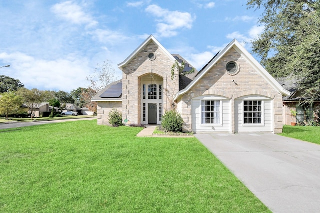 french country style house featuring a front lawn and solar panels