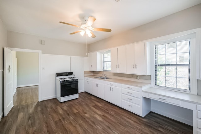 kitchen with white cabinetry, sink, ceiling fan, dark hardwood / wood-style flooring, and white range with gas stovetop