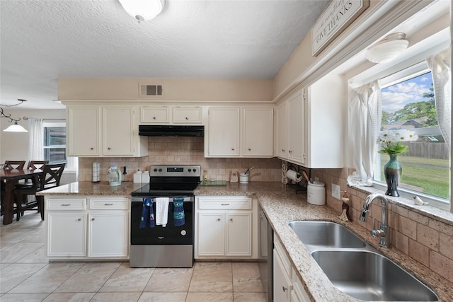 kitchen with pendant lighting, sink, white cabinetry, and stainless steel appliances