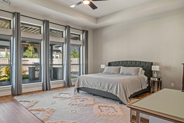 bedroom featuring hardwood / wood-style flooring and ceiling fan