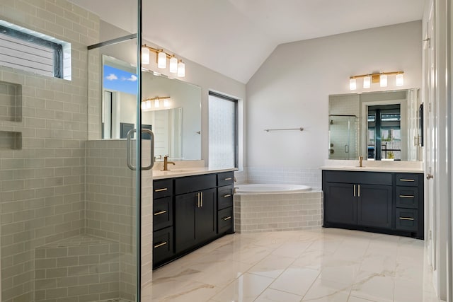 bathroom featuring plus walk in shower, vanity, and lofted ceiling