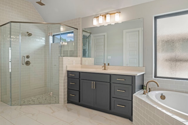 bathroom with plus walk in shower, vanity, and vaulted ceiling