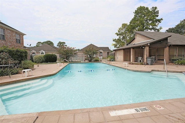 view of swimming pool with a patio