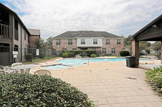 view of pool featuring a hot tub