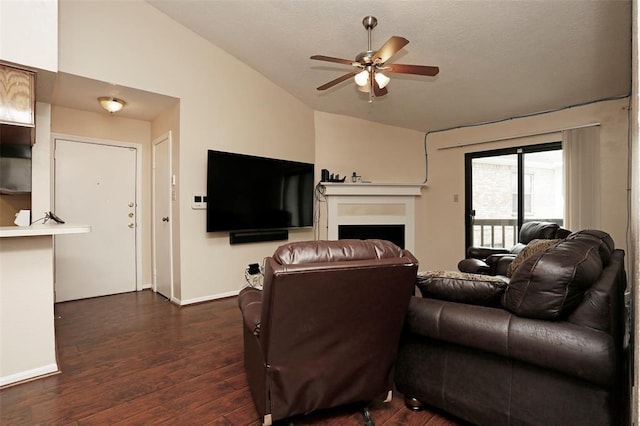 living room featuring ceiling fan, dark hardwood / wood-style flooring, and lofted ceiling