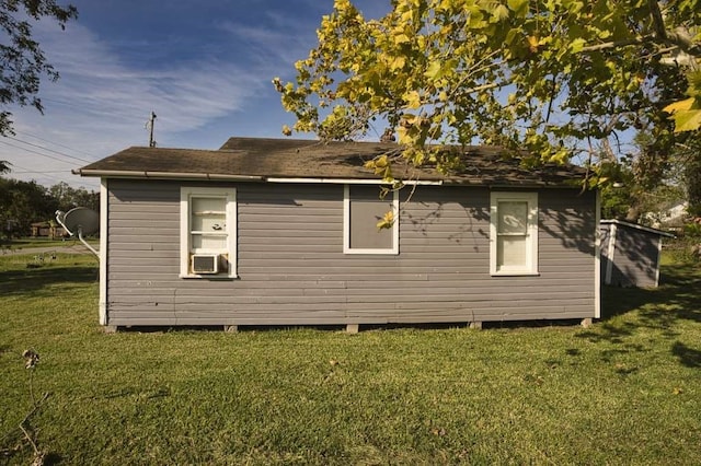 view of side of home featuring a lawn