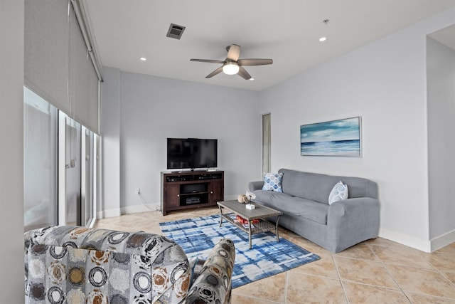 living room with light tile patterned floors and ceiling fan