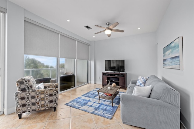 tiled living room with ceiling fan