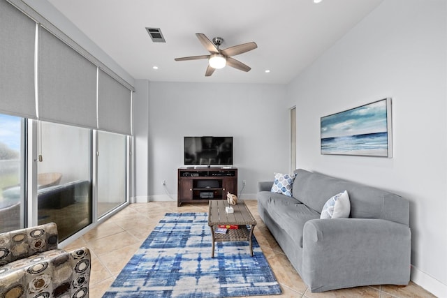 living room with ceiling fan and light tile patterned floors