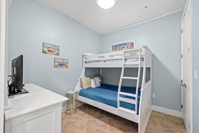 bedroom featuring light tile patterned flooring