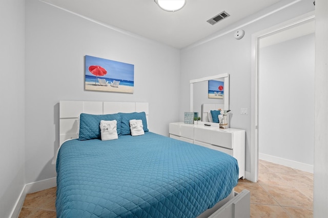 bedroom with light tile patterned flooring