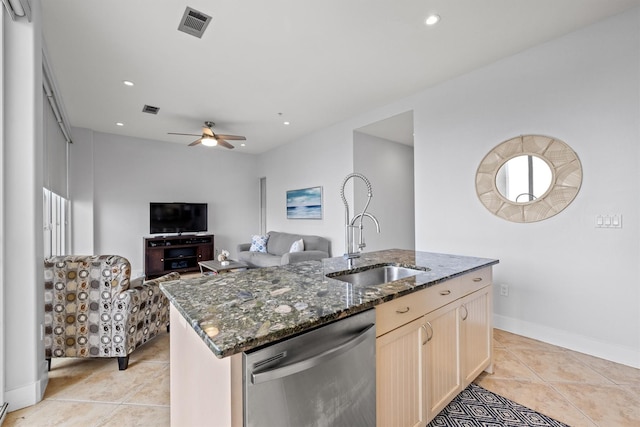 kitchen featuring ceiling fan, sink, stainless steel dishwasher, a center island with sink, and light tile patterned floors