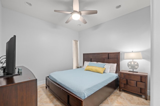 tiled bedroom featuring ceiling fan