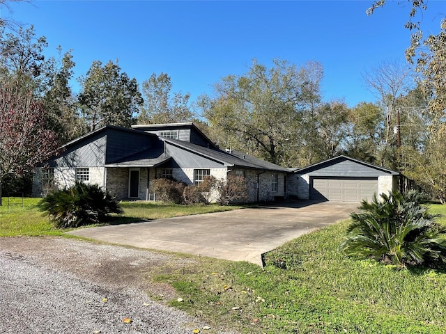 view of front of property with a garage and a front lawn