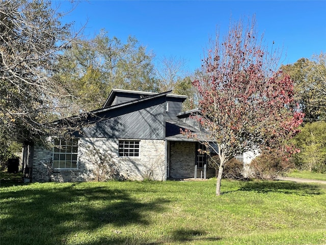 view of property exterior featuring a lawn