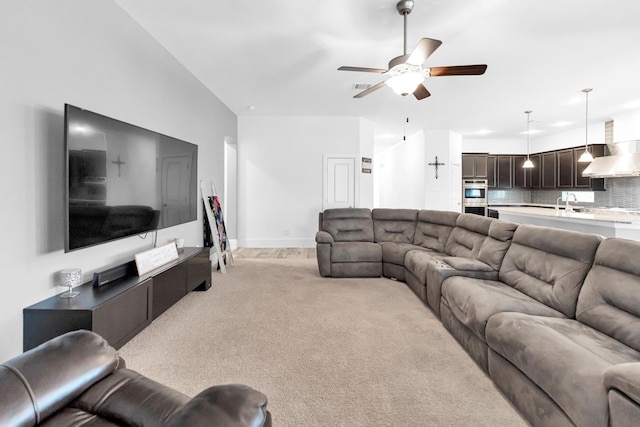 living room featuring ceiling fan and light colored carpet