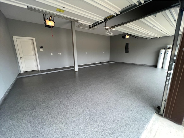 garage featuring a garage door opener and electric panel