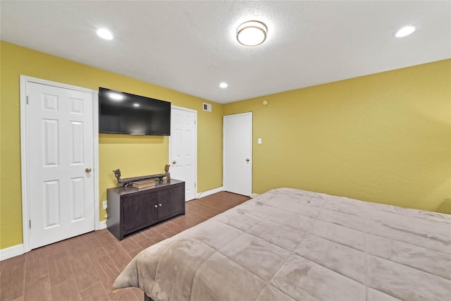 bedroom featuring wood-type flooring