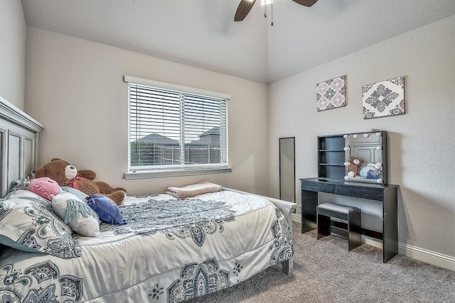 carpeted bedroom featuring vaulted ceiling and ceiling fan