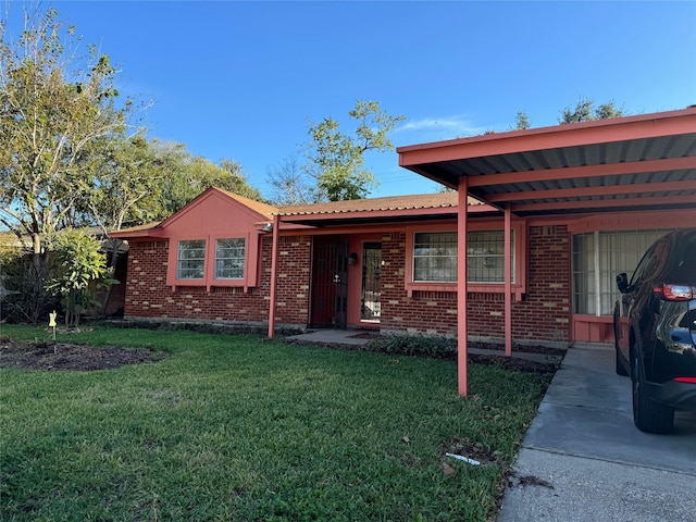 single story home with a carport and a front yard