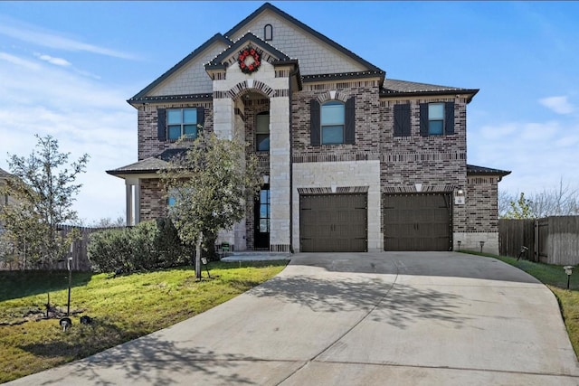 view of front of property with a garage and a front yard