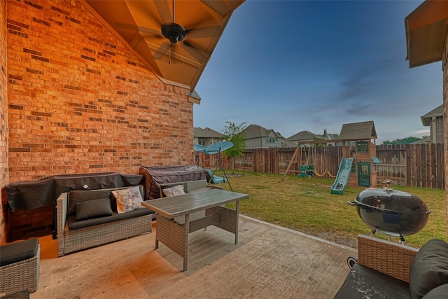 view of patio / terrace with an outdoor living space and a playground