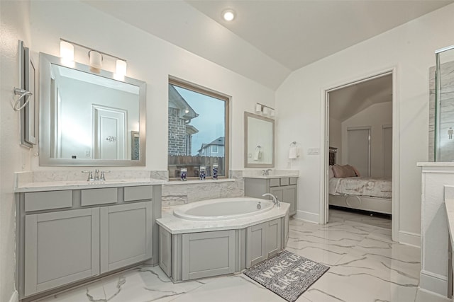 bathroom featuring vanity and lofted ceiling