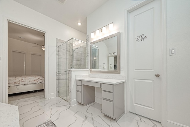 bathroom with vanity, an enclosed shower, and ceiling fan