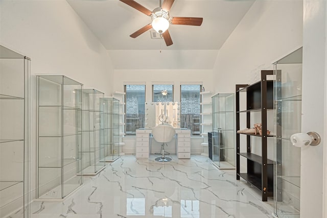 bathroom with ceiling fan and toilet