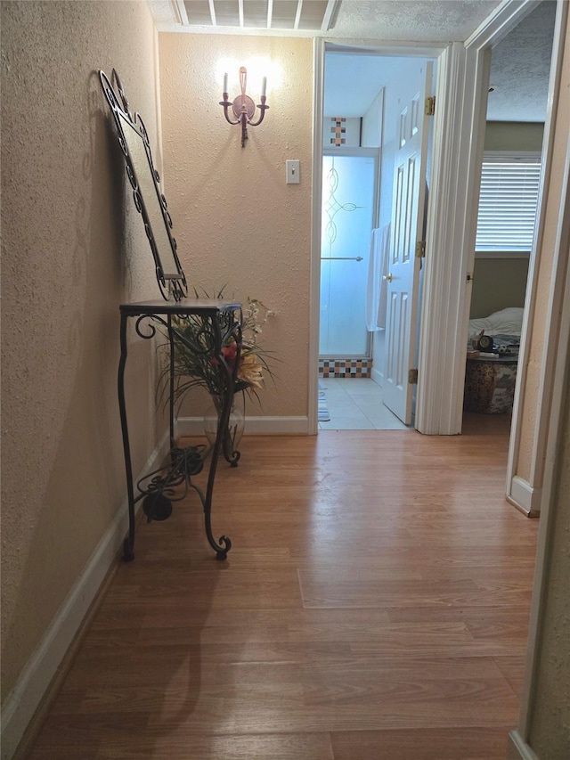 hallway featuring light wood-type flooring