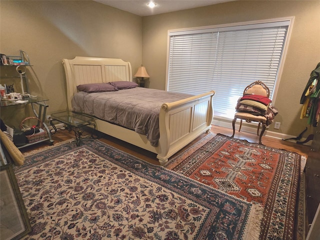 bedroom with hardwood / wood-style floors