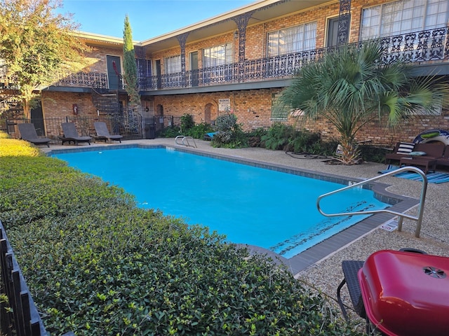 view of pool featuring a patio