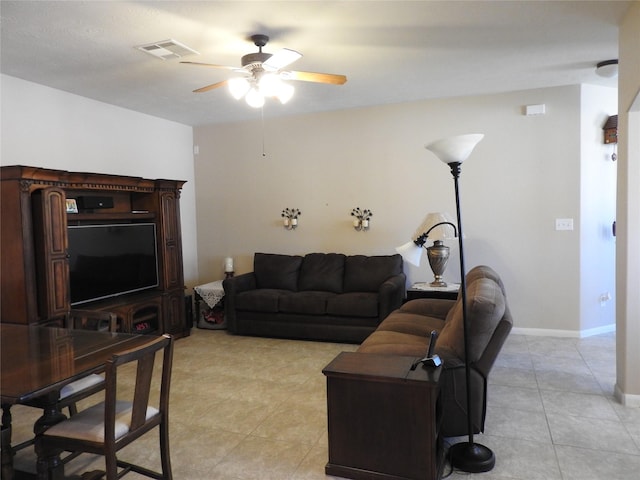 living room featuring ceiling fan and light tile patterned floors